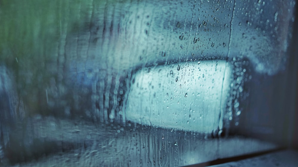 vehicle window with water particles