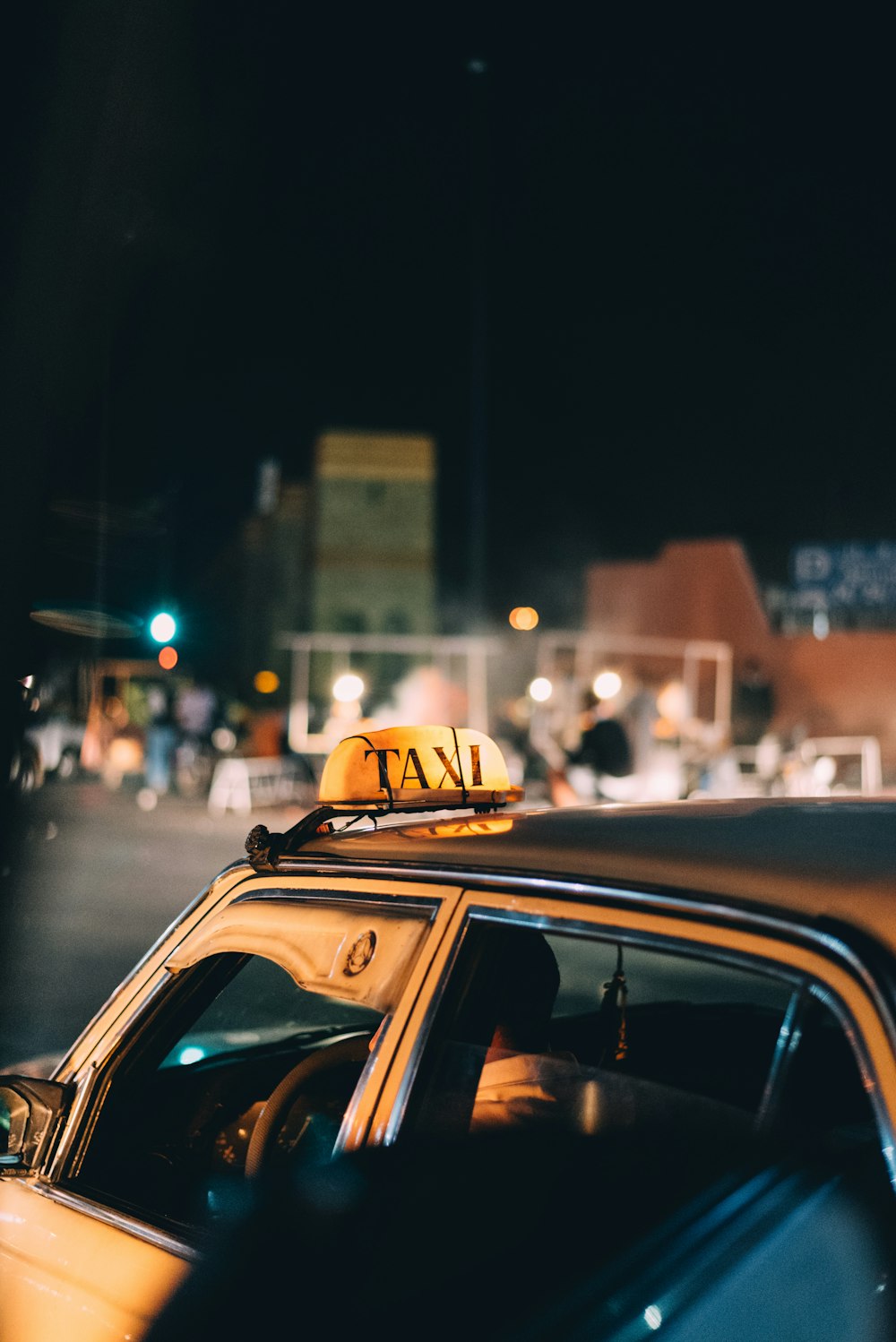 black taxi car during night