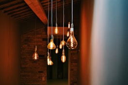 turned on orange pendant lamps