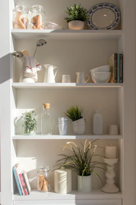 A set of elegant kitchen and bathroom organizers neatly arranged on shelves.