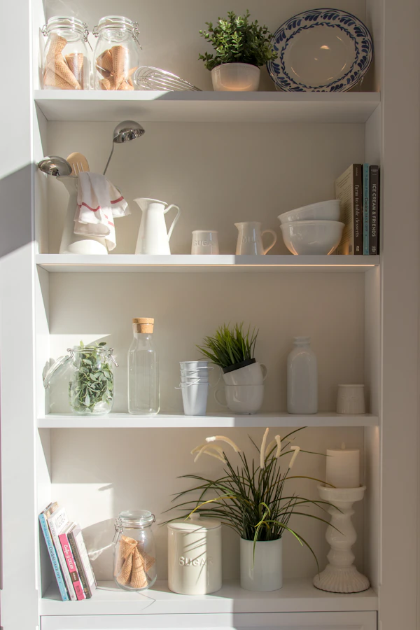Elegant home storage shelving with bowls and bottles