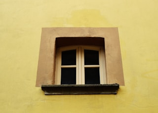 closed white wooden framed 2-pane window