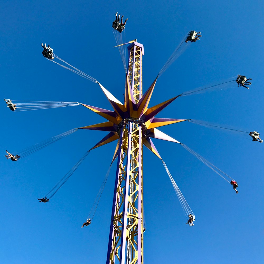 person amusement park rides taken at daytime