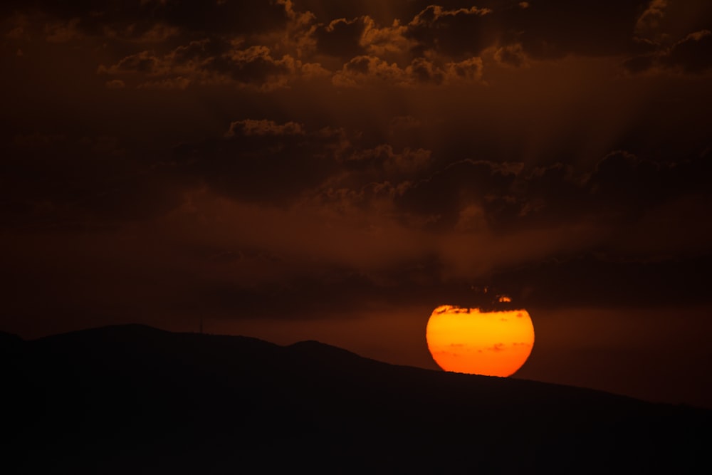 mountain with clouds during sunset view