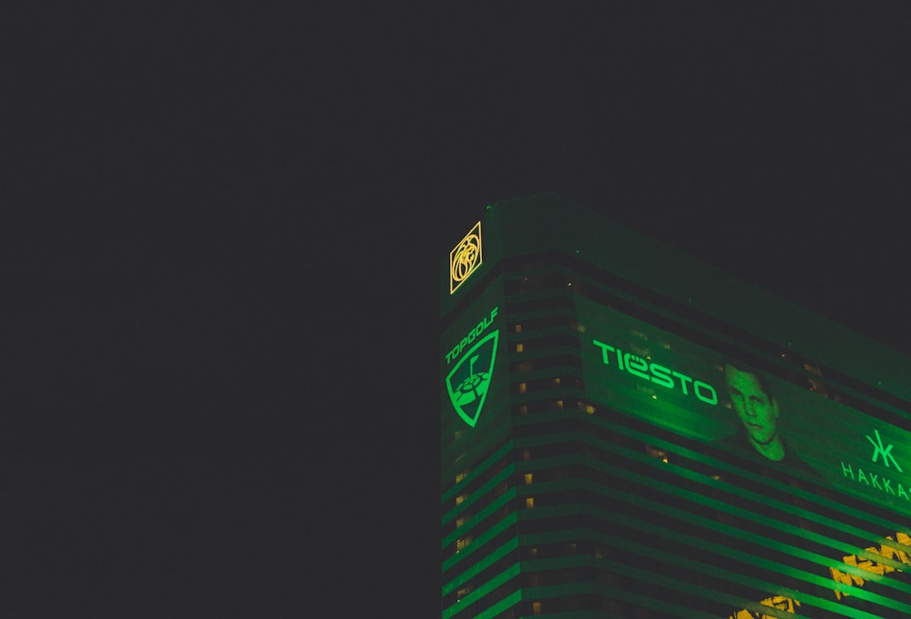 Tiesto digital billboard on high-rise building during night
