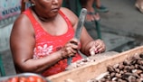 a woman holding a large knife in her hands