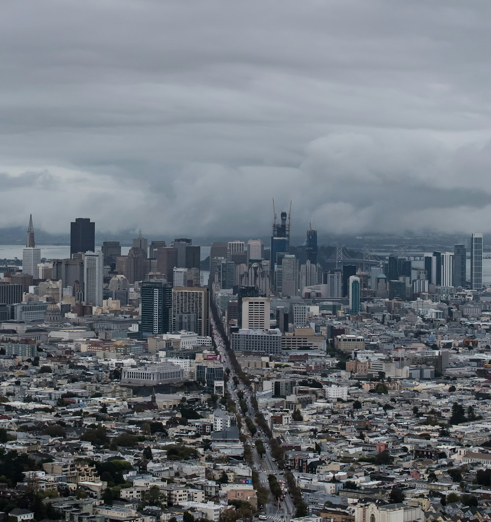 buildings with fog during daytime