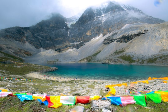 large body of water near mountain during daytime in Sichuan China