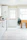 Bright kitchen showcasing custom-built cabinetry with elegant baseboards and crown moulding.