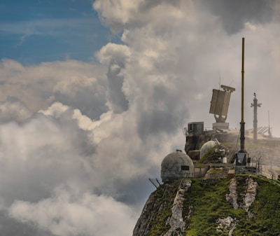 An outdoor shot of environmental monitoring equipment set up in a green landscape.