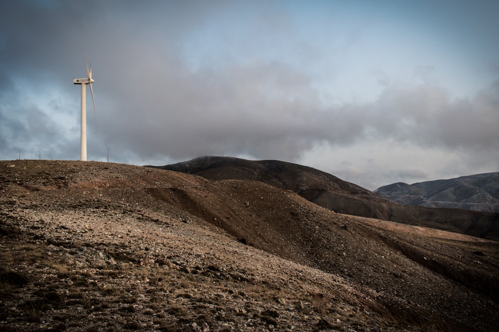 low-angle photography wind turbine under white sky