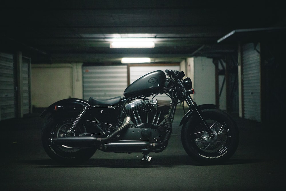 black bobber motorcycle inside garage