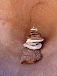 Stack of natural Pedra Marroada stones arranged for paving.