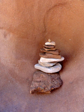 Stack of natural Pedra Marroada stones arranged for paving.