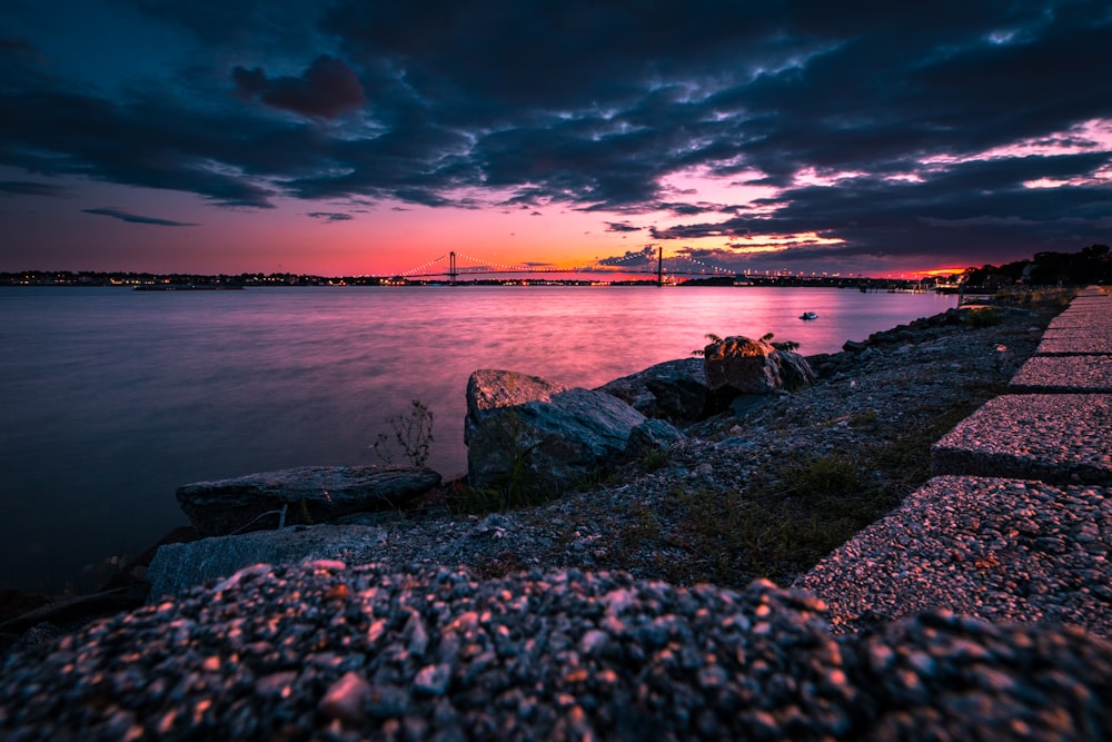 silhouette photography of body of water