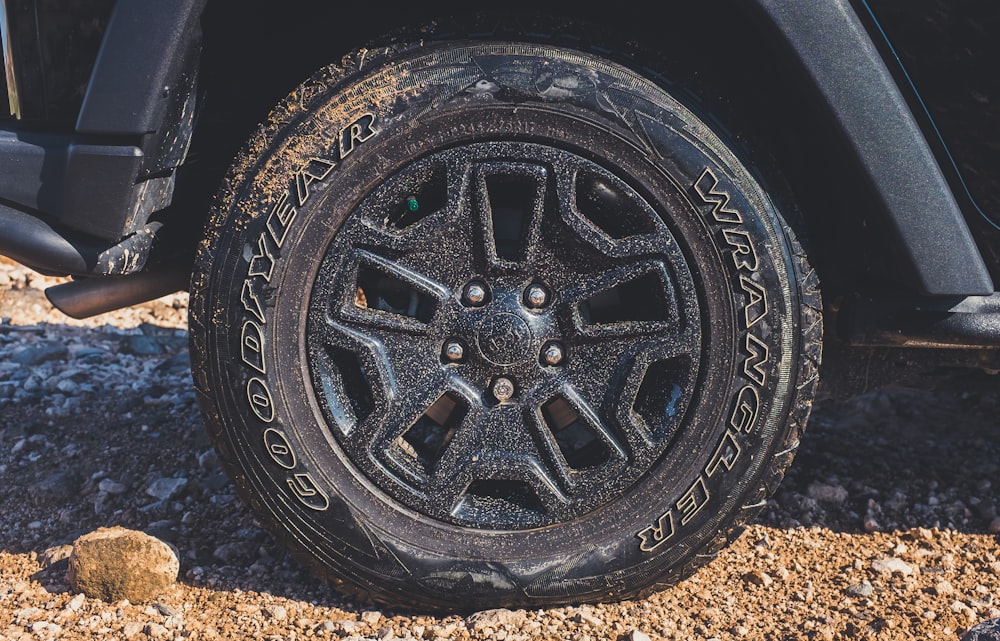 black vehicle wheel with Wrangler tire