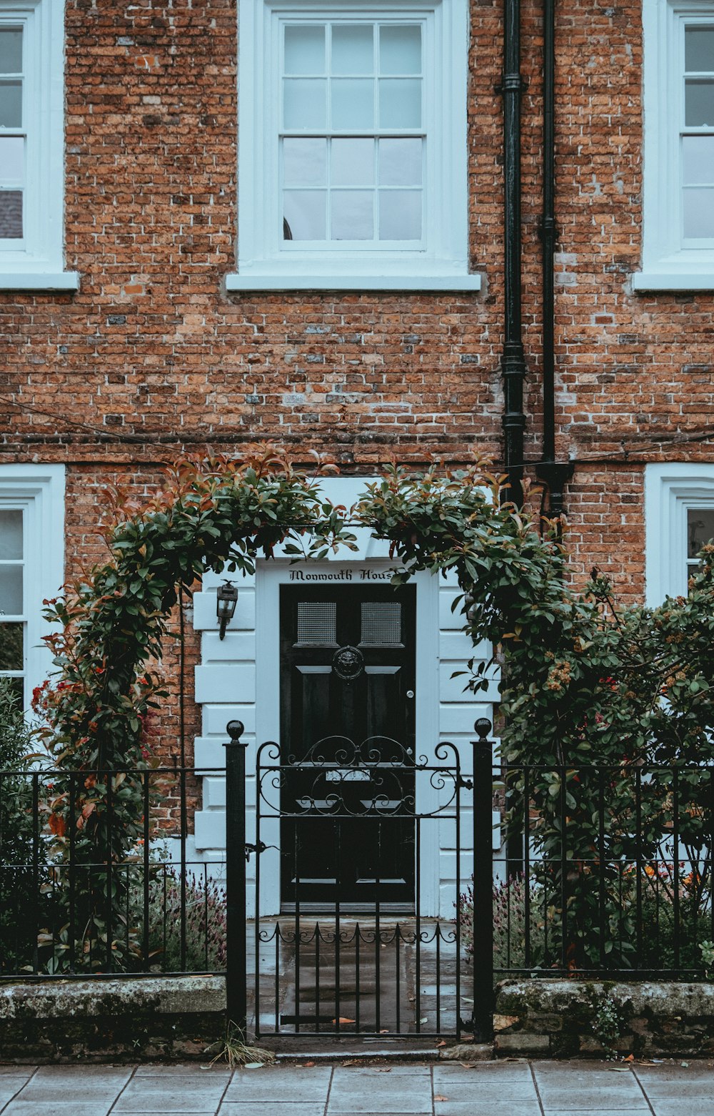 brick building with black fence