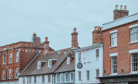 white and brown concrete buildings under blue sky during daytime in Lymington United Kingdom