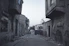 gray concrete pathway between buildings