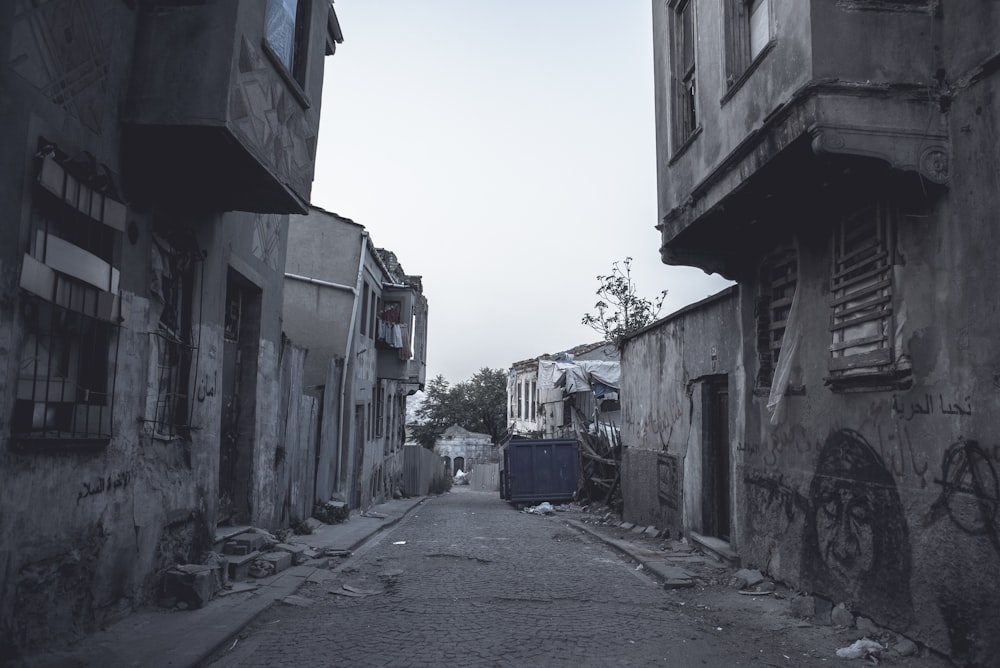 gray concrete pathway between buildings