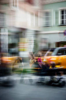 A candid street scene capturing urban life with vibrant colors and dynamic movement.