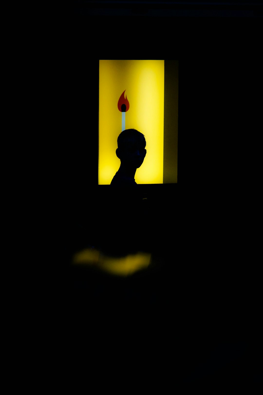 silhouette of human toward with lighted room photography