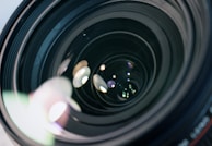 Macro shot of a precision lens surface, capturing the clarity and smooth finish that defines our optical products.