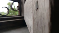 Close-up photograph of matte forest green PVC window frame highlighting texture and finish.
