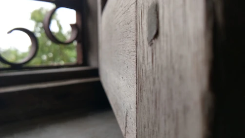 Close-up of finely crafted wooden window frame with natural grain visible
