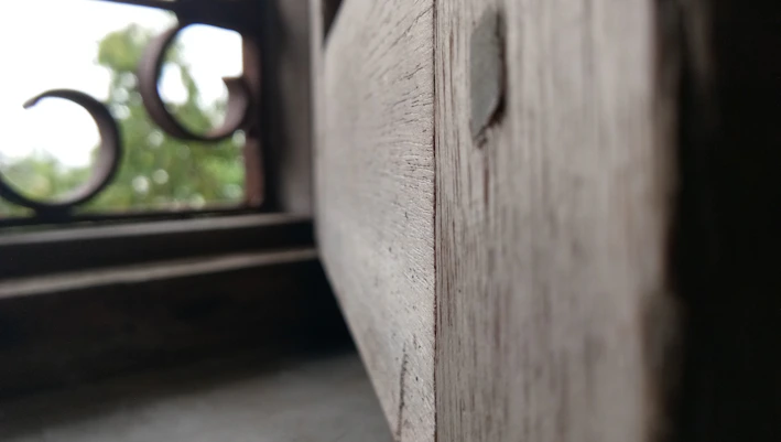 Close-up of elegant dark wood louvered shutters with rich texture