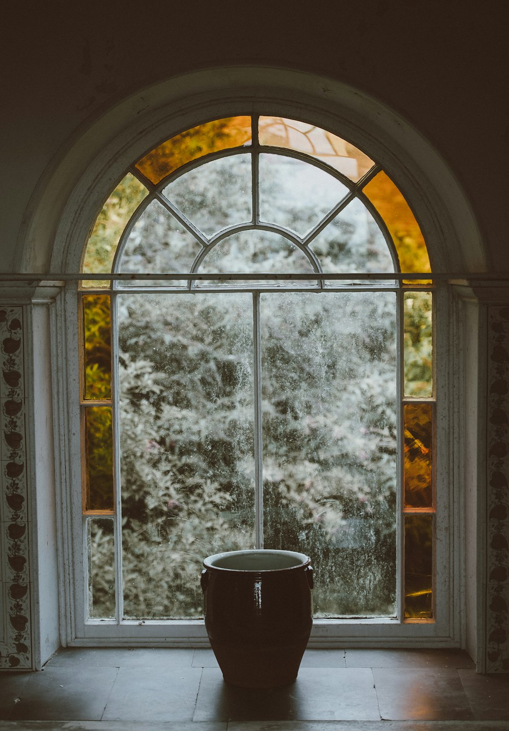 Maceta en ventana de vidrio