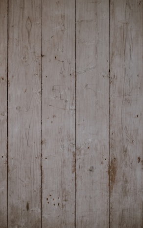 Weathered pine cladding with a rustic finish, highlighting knots and natural imperfections.
