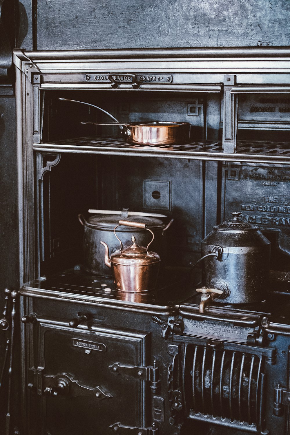 gray stainless steel teapot on range oven