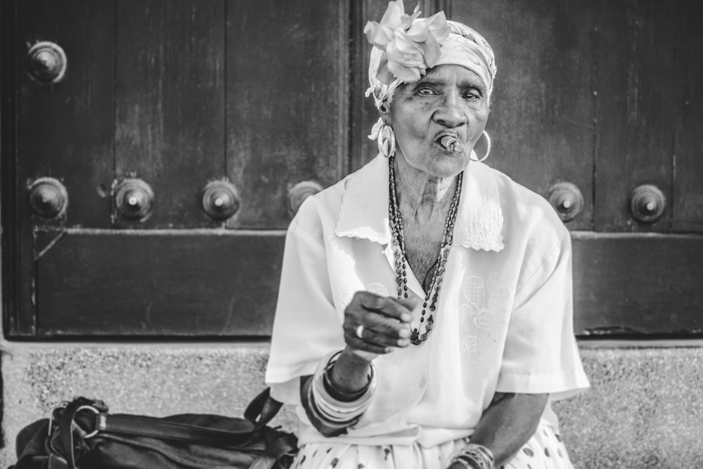 gray scale photo of woman sitting