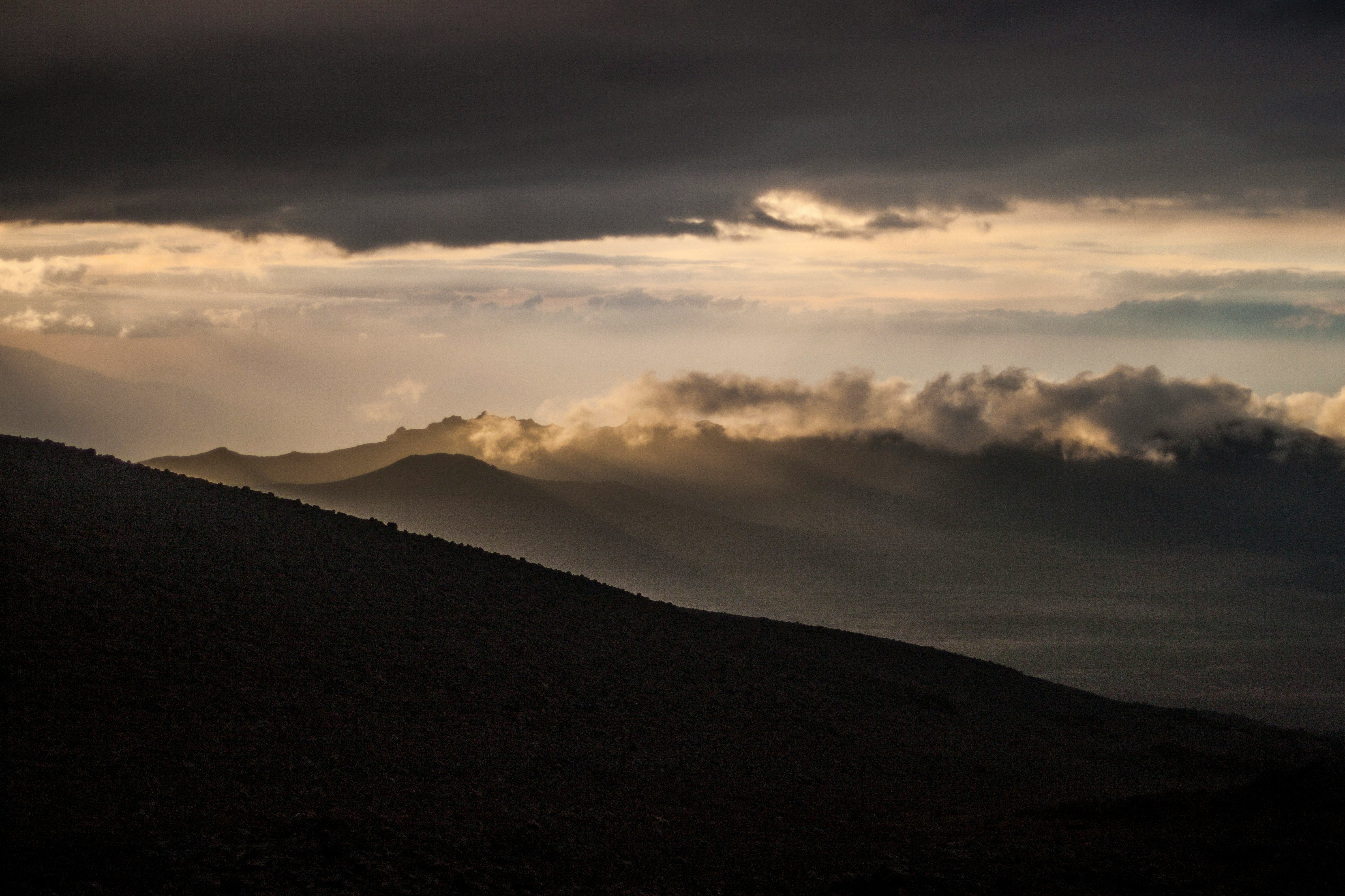 mountain under gray sky