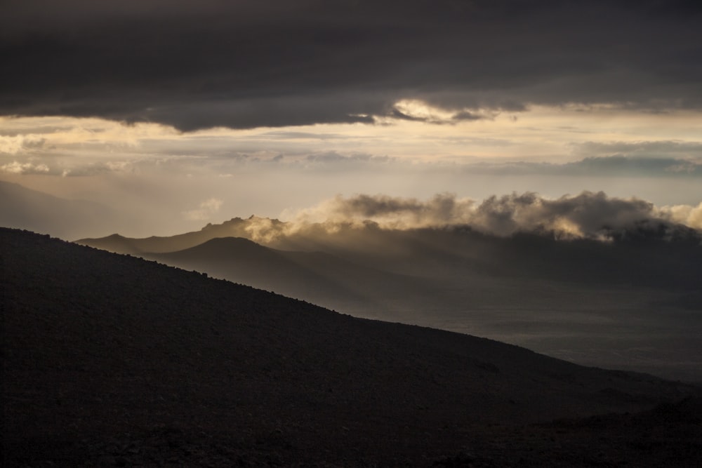 mountain under gray sky