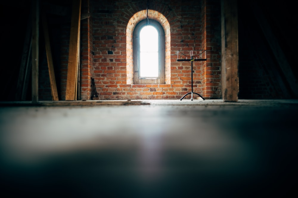 low-angle photo of concrete wall and window