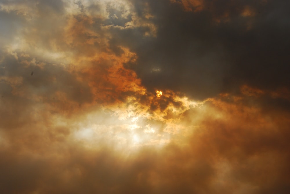 photo of sun covered by white clouds