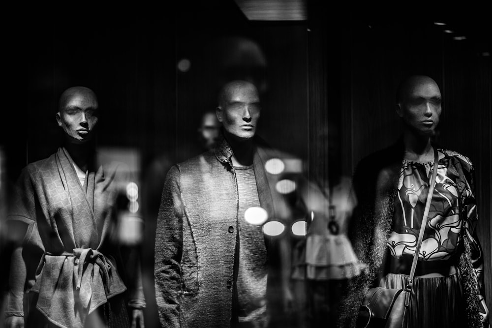 grayscale photography of mannequins wearing shirts