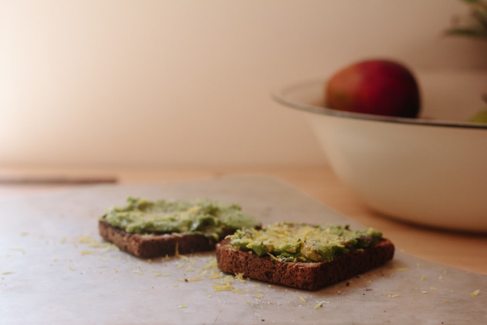 two toasted breads on chopping board