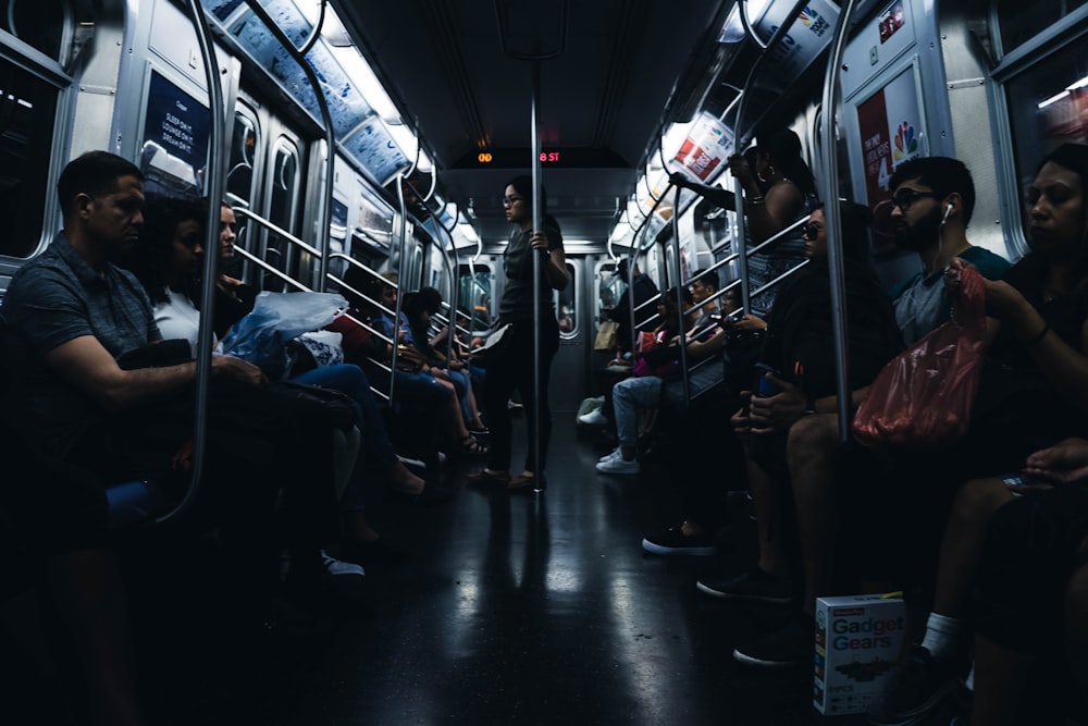 group of people riding train