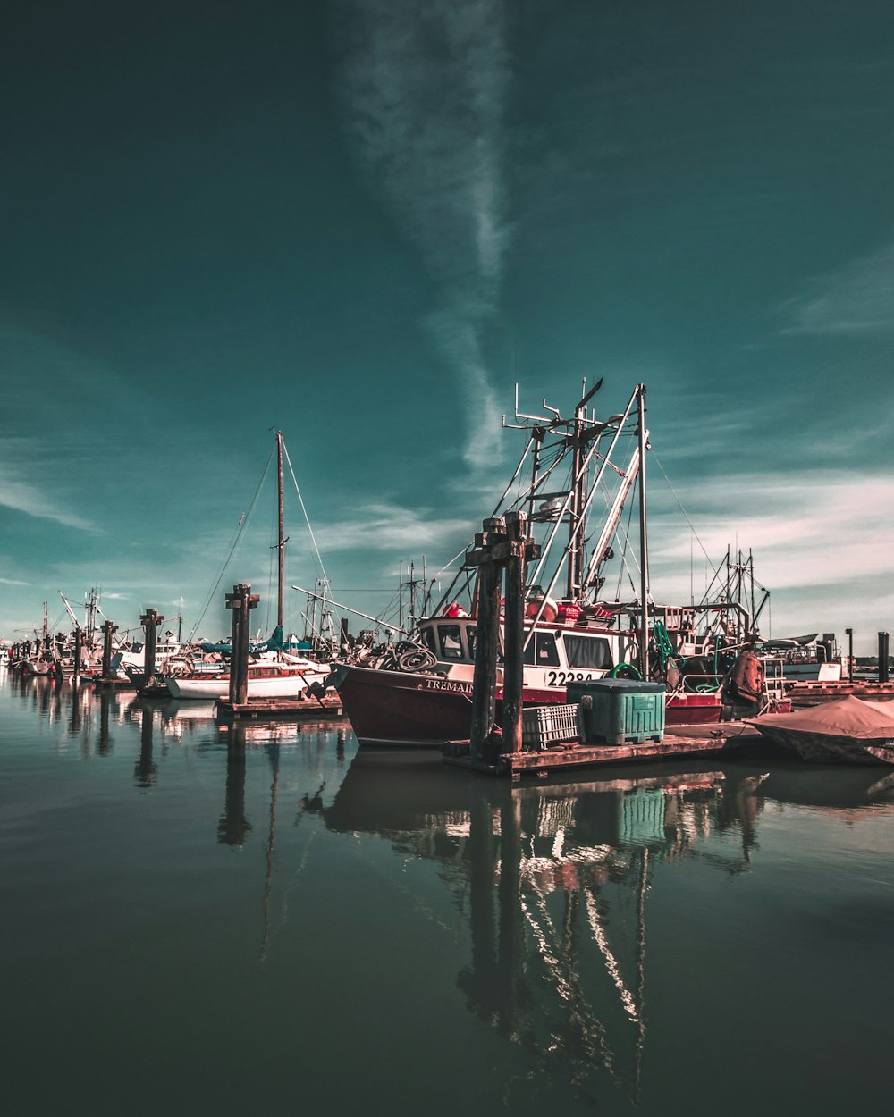 ship on body of water under blue sky