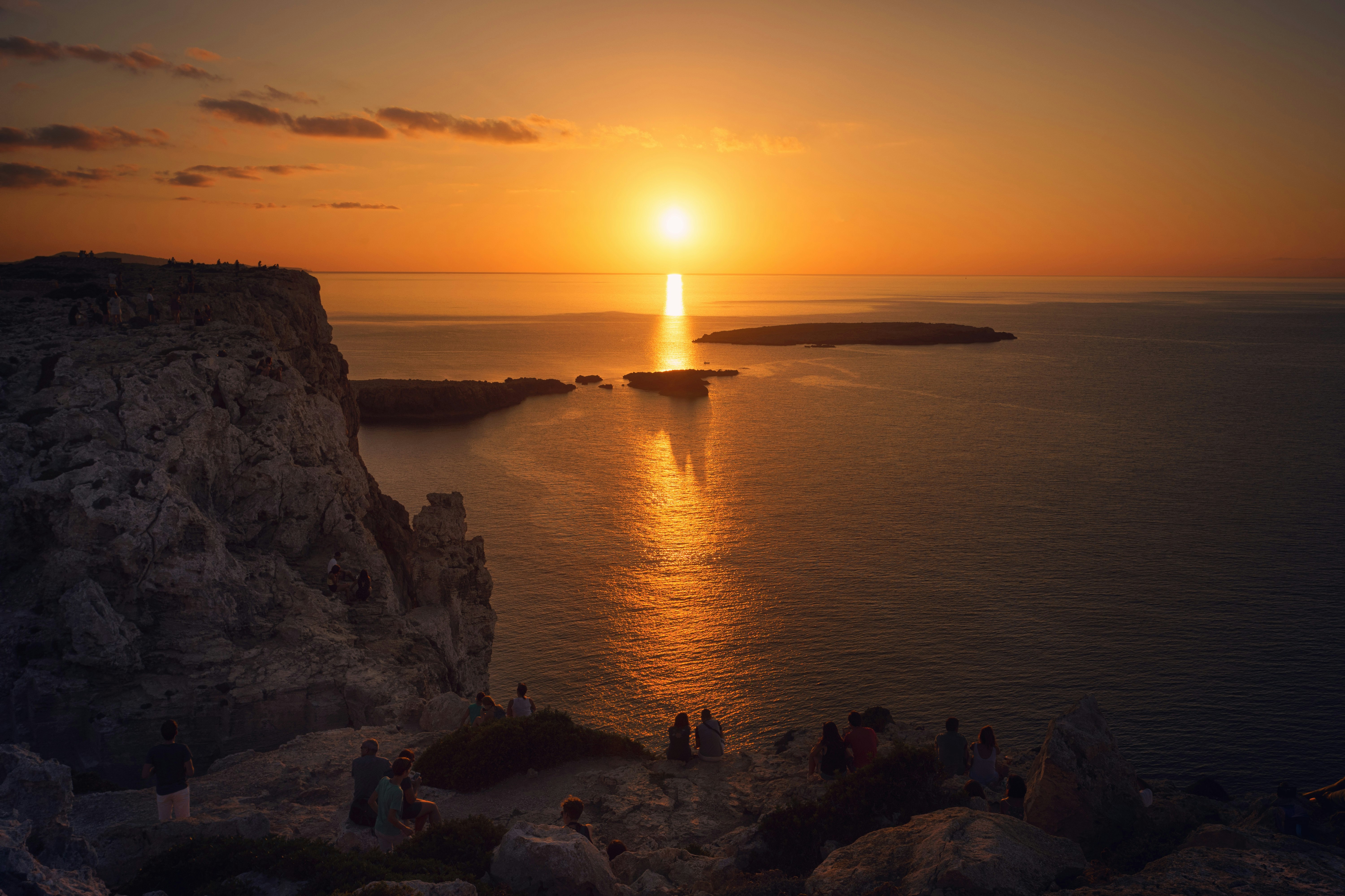 photo of body of water during golden time