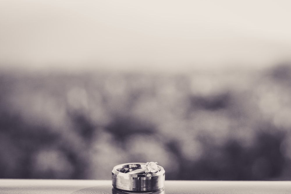 selective focus photography of silver-colored ring