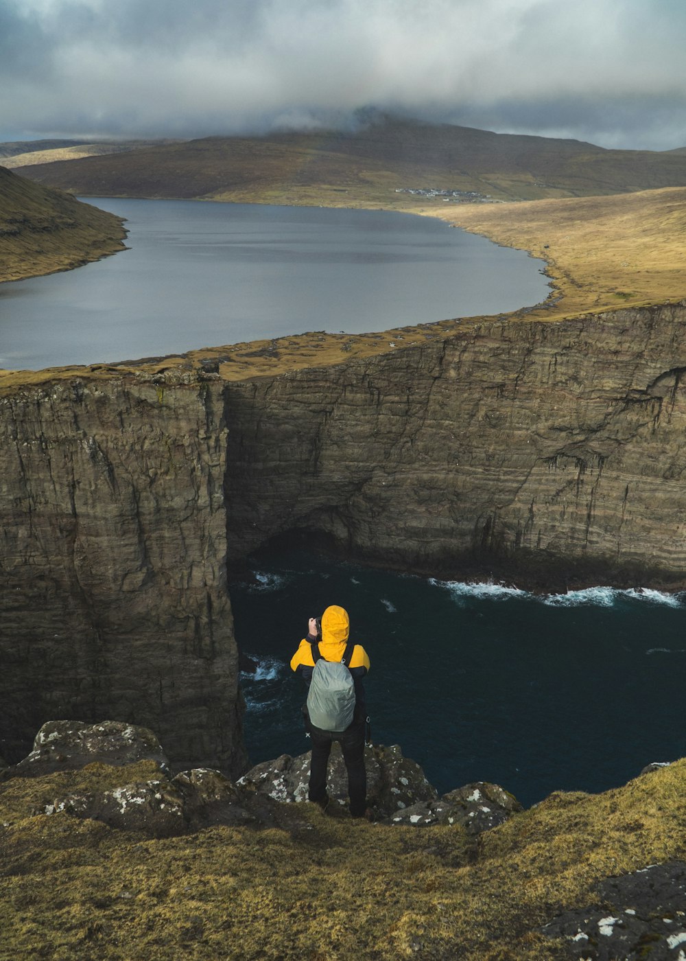 man standing on the edge of the cliff