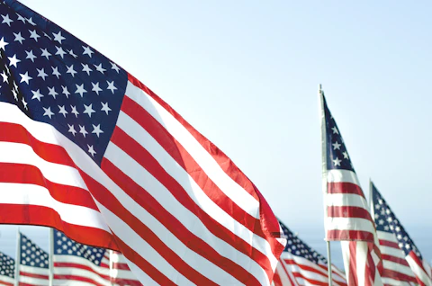 US flags under clear sky