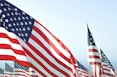 US flags under clear sky