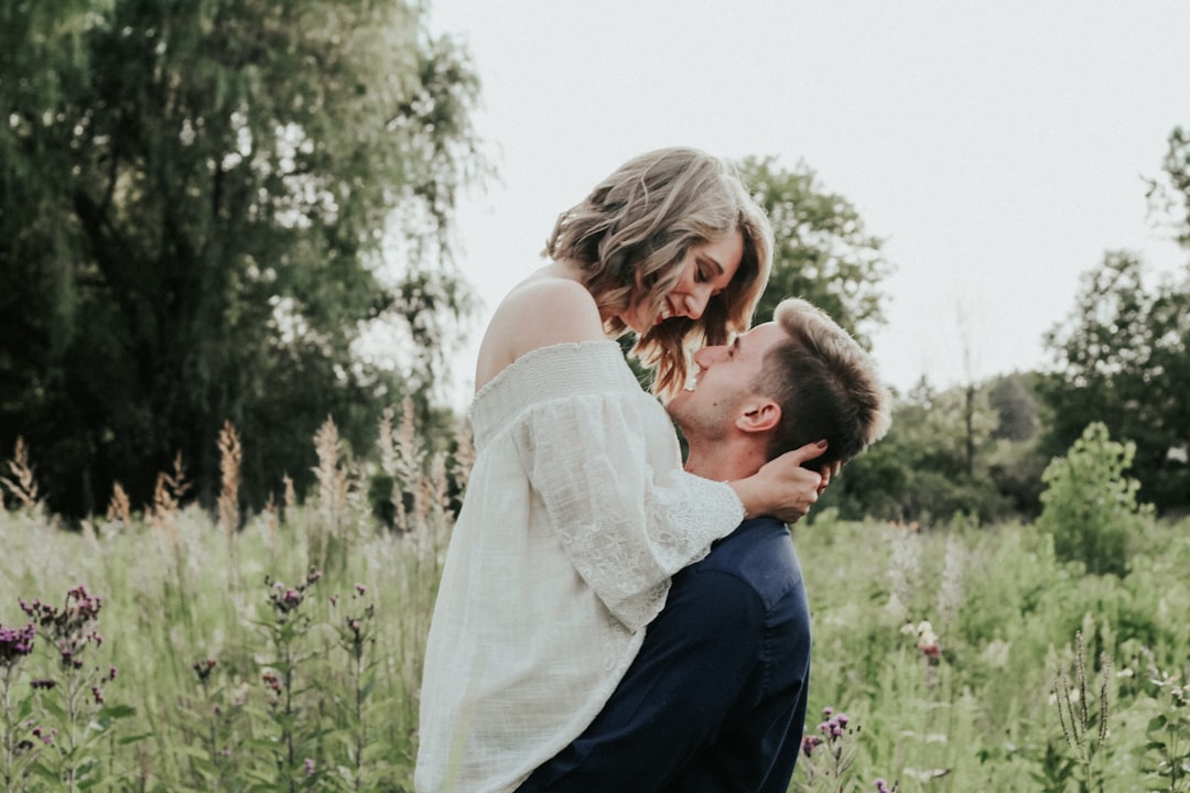 couple near green tree during daytime