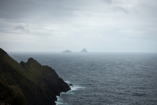 body of water and mountain with fog in County Kerry Ireland