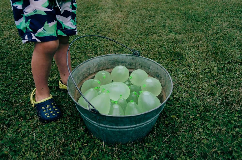 green balloons on gray stainless steel bucket